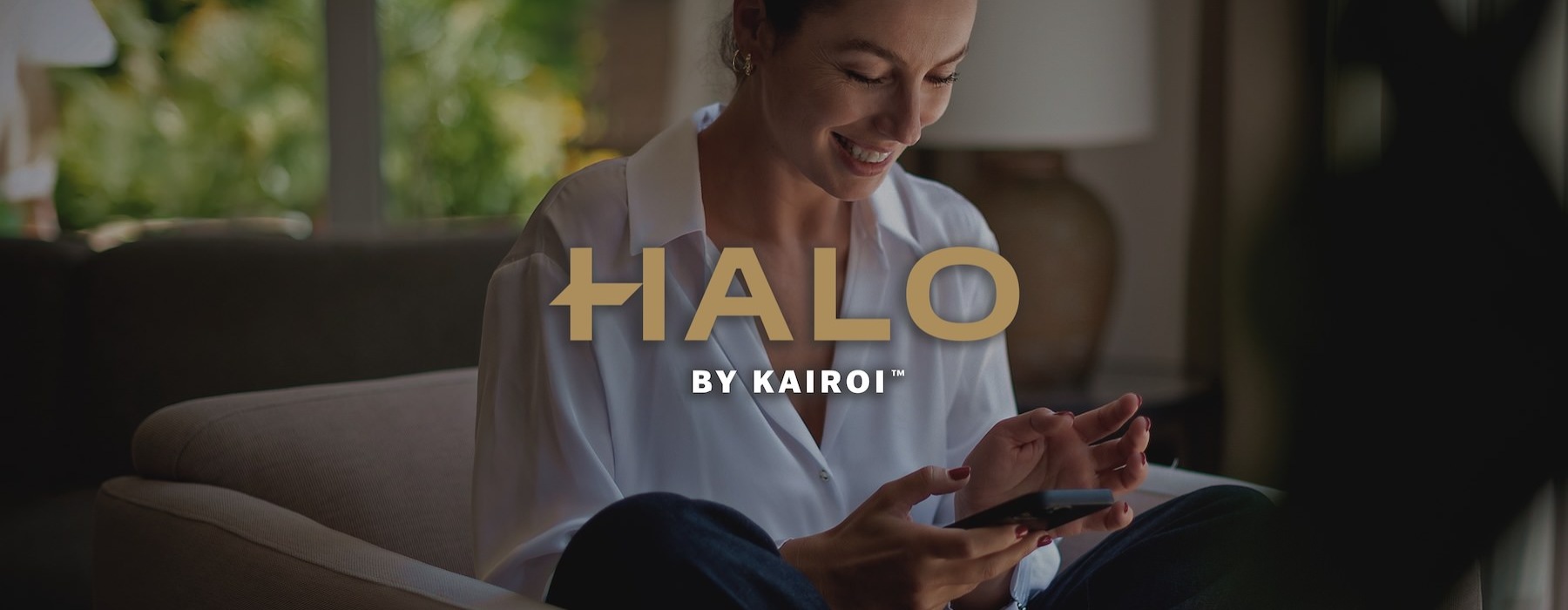 a woman smiling and interacting with her device