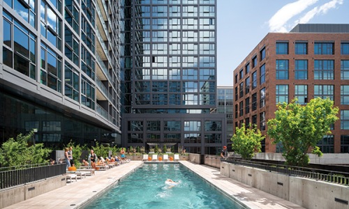 swimming pool with a large building in the background